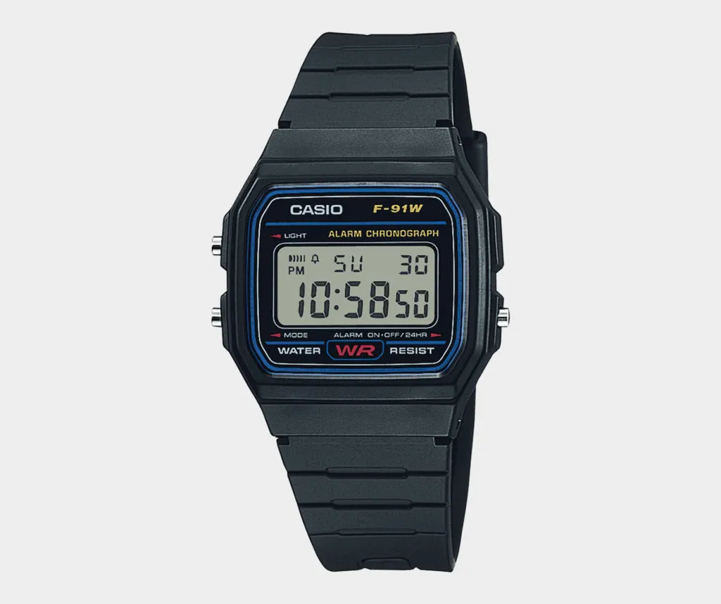 A black Casio F91 digital wristwatch displaying the time 10:58:30 on its screen, known for zero updates over thirty-five years.