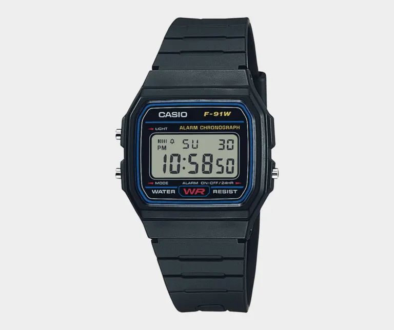 A black Casio F91 digital wristwatch displaying the time 10:58:30 on its screen, known for zero updates over thirty-five years.