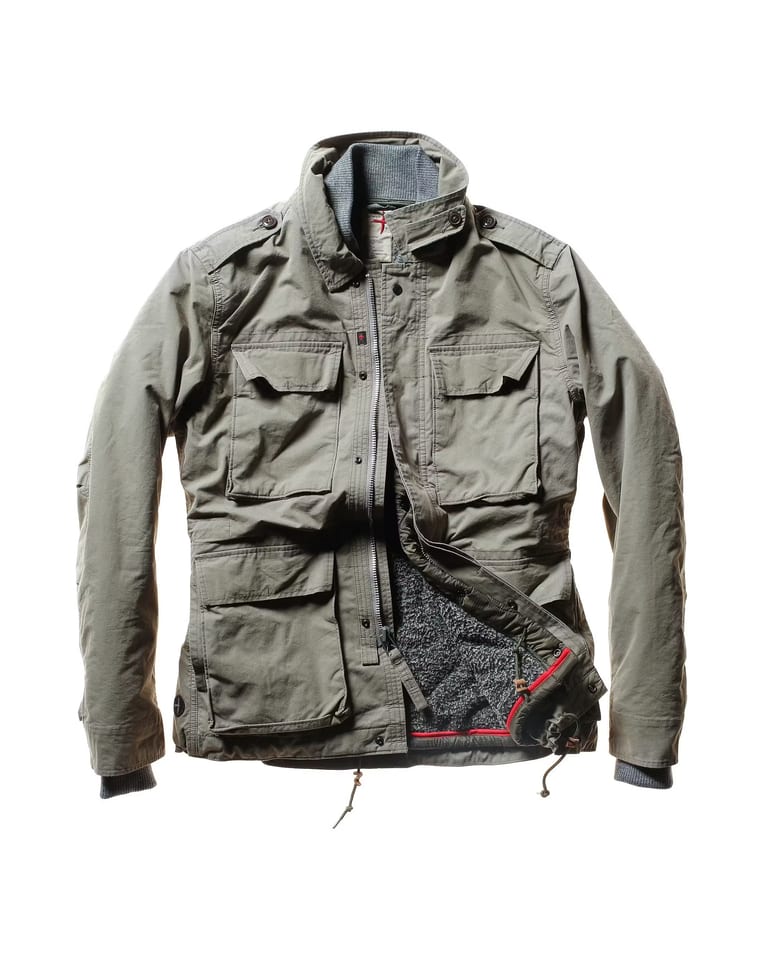 Olive green utility jacket with multiple pockets, partially unzipped to show inner lining and details—crafted in the signature Relwen Combat style, this versatile 2-in-1 jacket offers both function and effortless edge.